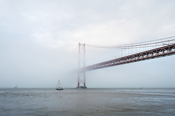 Image showing View of 25 de Abril Bridge famous tourist landmark of Lisbon in heavy fog mist