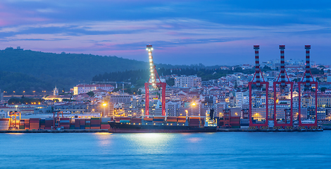 Image showing View of Lisbon port with ship and port cranes in the evening