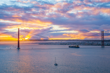 Image showing View of 25 de Abril Bridge over Tagus river on sunset. Lisbon, Portugal