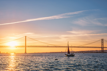 Image showing View of 25 de Abril Bridge over Tagus river on sunset. Lisbon, Portugal