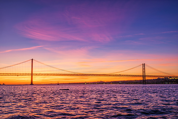 Image showing View of 25 de Abril Bridge over Tagus river on sunset. Lisbon, Portugal