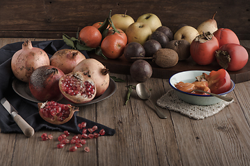 Image showing Autumn fruits on rustic table