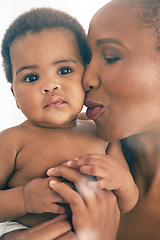 Image showing Black woman with baby, face and hug with family, content and bonding with love and early childhood and happiness. African female, mother holding child with parenting, motherhood and cuddle with care