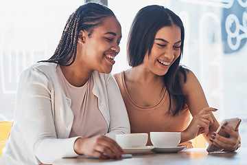 Image showing Women friends, coffee shop and phone with smile, happy and laugh at comic meme on social network. Gen z black woman, smartphone and relax in cafe with blog, funny video or texting app ux on internet