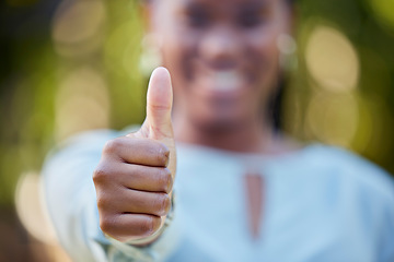 Image showing Hand, closeup and thumbs up by black woman showing yes, recommendation or thank you on bokeh background. Zoom, hands and emoji sign, symbol or icon by corporate employee in agreement, support or vote