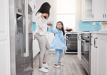 Image showing Mother, dancing and girl in the kitchen with bonding, parent care and love in a family home. Mom child and happy dance in a house with happiness, fun and dancer activity with mama support in morning