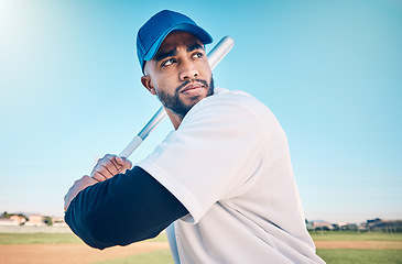 Image showing Sports, baseball and man with bat on field ready for hitting ball in game, practice and competition. Fitness, motivation and male athlete outdoors for exercise, training and workout for sport match
