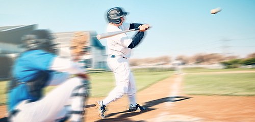 Image showing Baseball bat, athlete swing and speed ball on a outdoor sport field with team and blur. Sports fast pitch, softball player and man on stadium ground in a stadium and usa game for fitness training