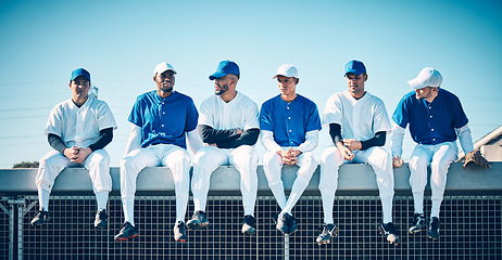 Image showing Baseball team, sport athlete communication and men fitness sitting to relax before softball game. Sports, diversity and friends group together in a stadium ready for exercise, training and teamwork