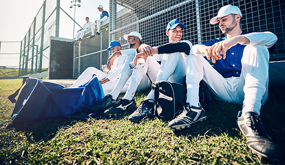 Image showing Baseball team, sitting and grass for training, relax and conversation with men, sports or solidarity. Man, friends and sport with teamwork, diversity and talk for match, game or competition in summer