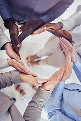 Image showing Hands, collaboration and workflow with a business team standing in a circle at the office from above. Meeting, partnership and teamwork with a group of people in a huddle for growth or synergy