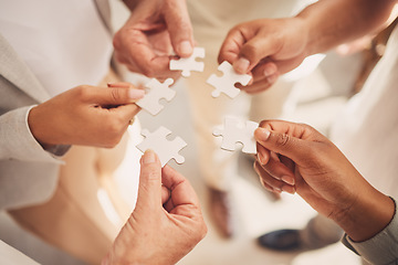 Image showing Team collaboration hands, teamwork and puzzle piece showing office community and innovation. Diversity, partnership and project management staff doing work productivity and business development