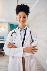 Image showing Portrait, black woman and doctor arms crossed, healthcare and smile in hospital, leader and confident. Face, African American female surgeon, employee or medical professional with skills or happiness