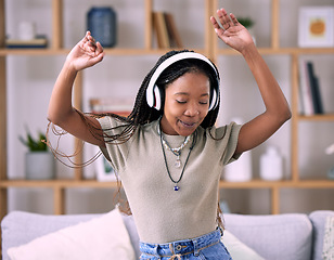 Image showing Black woman, dancing and music headphone in home living room with energy and wifi connection. Young person dance while listening to audio, sound and radio or podcast for freedom, motivation and relax