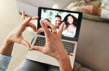 Image showing Hand heart, video call and love with laptop, family and communication with emoji, connection and bonding. Hands, person relax at home and happiness with care, connectivity with virtual chat in lounge