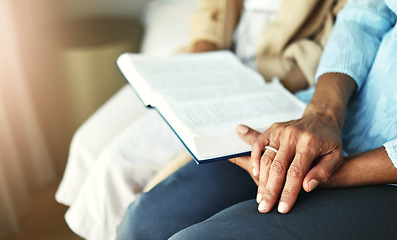 Image showing Hands, bible and senior couple praying in their home together for scripture, faith and trust. Family, worship and praise with elderly man and woman united in prayer, holy or gratitude to Jesus Christ