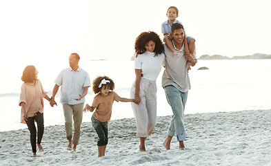 Image showing Latino family, beach and walking on summer vacation, quality time and bonding for fun and wellness. Grandparents, mother and father with children, seaside holiday and travelling for adventure and joy