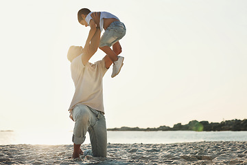 Image showing Playing, bonding and father with a child at the beach for quality time, holiday and caring in Brazil. Family, love and dad holding his son for play, activity and together at the ocean for happiness