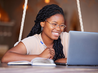 Image showing Happy, class and black woman doing elearning on a laptop, studying and learning with notes. Education, smile and African home student doing online work, homework and preparing for an exam on a pc