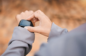 Image showing Hands, fitness and smartwatch screen in nature to track health, wellness and workout goals. Sports progress, technology app and woman athlete with watch for time, exercise schedule or running targets