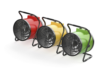 Image showing Three electric fan heaters with different colors