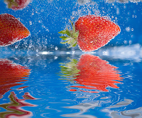 Image showing Plunging Strawberries 