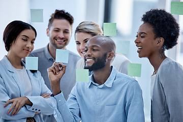 Image showing Business, team and black man writing on sticky note, brainstorming and planning for project, smile and collaboration. Corporate, Nigerian male leader or staff share ideas, advertising agency or sales