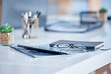 Image showing Business, documents and books with glasses on office desk or table for corporate analysis or information. Notebook, diary or schedule planning tools and equipment of writing or reading material