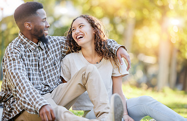 Image showing Happy, relax and interracial couple at a park for a date, quality time and bonding in Australia. Summer, love and black man and a woman in nature, laughing and talking in a relationship together