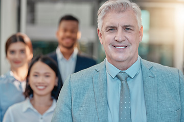 Image showing Portrait, leader and senior businessman with team in office for collaboration, teamwork and startup goal. Face, diversity and elderly guy boss leading team in partnership, company and happy workforce