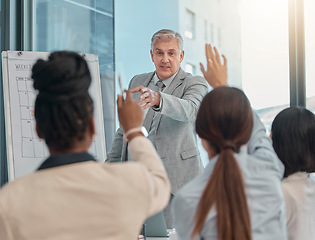 Image showing Senior businessman, coaching and presentation with question in team collaboration or engagement at office. Elderly male CEO leader or coach training staff with hands raised in FAQ, teamwork or answer