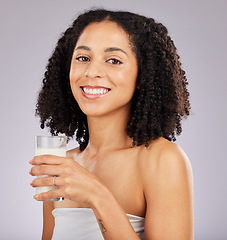 Image showing Coconut milk, health and portrait of happy black woman with wellness drink for skincare. Calcium nutrition, collagen and eco friendly smoothie of a model with smile from detox product with studio