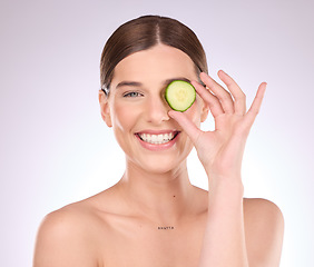 Image showing Woman, portrait or hand with cucumber for skincare nutrition or healthy diet isolated studio background. Face of happy beauty model with smile, fruit or organic facial treatment or natural cosmetics