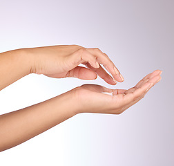 Image showing Hands, lotion and beauty, skincare and woman, manicure and nail polish with cosmetics on studio background. Sunscreen, moisturizer application and dermatology with cream cosmetic product and female