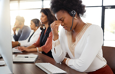 Image showing Call center, headache and black woman stress in telemarketing team with crm problem. Customer service anxiety, web support and burnout of a technical office employee working online on a help desk