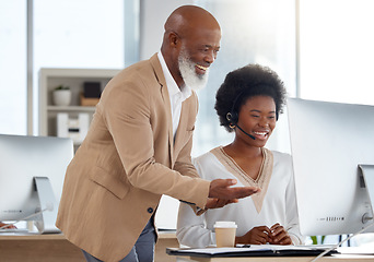 Image showing Call center, customer support and manager helping a consultant with an online consultation. Contact us, professional and African male leader training a female employee with crm strategy in the office