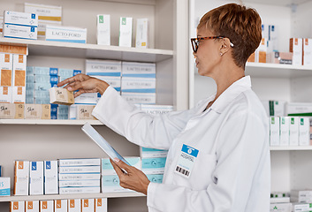 Image showing Pharmacy woman, tablet and medicine shelf to check inventory and product information search. Pharmacist person with Pharma app in clinic or shop for pharmaceutical, medical and health search or order