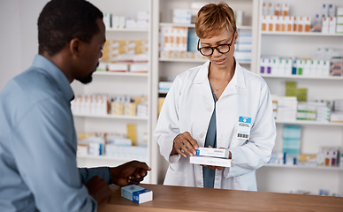 Image showing Pharmacist woman, medicine and healthcare with customer while reading information on pills box. Black man with pharmacy, clinic or store worker for pharmaceutical, medical and health counter service