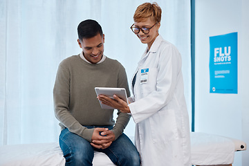 Image showing Tablet, black woman and patient consulting doctor in hospital for health results. Healthcare consultation, technology or happy senior female or medical physician with touchscreen while talking to man