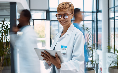 Image showing Doctor, tablet and black woman in busy hospital or clinic for research, telehealth or online consultation. Healthcare app, technology and smile of happy senior medical professional with touchscreen.
