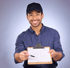 Image showing Delivery, signature and portrait of Asian man with paperwork isolated on a studio background. Happy, showing and courier asking to sign a document for approval of a service, import or package