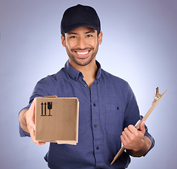 Image showing Portrait of delivery man giving box isolated on studio background for courier services, clipboard and smile. Asian worker, business or logistics person package in Korea distribution and product offer