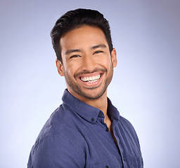 Image showing Business man, smile and portrait of a marketing manager from the Philippines in a studio. Isolated, blue background and happiness of a businessman and entrepreneur ready for professional working