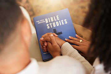 Image showing Religion, studying and couple holding hands with a bible for worship, prayer and trust in relationship. Love, care and man and woman with affection while learning about God, faith and Christianity