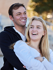 Image showing Relax, happy and couple at the beach for a date, bonding and quality time. Laughing, romantic and man and woman with affection, hugging and happiness in nature for a vacation or relaxing together