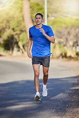 Image showing Fitness, running exercise and man on road for health, wellness and strength outdoors. Sports, training and young male athlete or runner workout, cardio jog or exercising for endurance and energy.