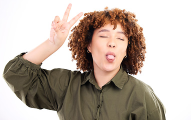 Image showing Fun, happy and peace sign by woman posing tongue out and closed eyes isolated in a studio white background. Gen z, excited and cool African American female or person with casual style and happiness