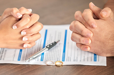 Image showing Divorce, signing and hands of a couple with a document for court, deal and legal paperwork. Together, conflict and married man and woman with an agreement, paperwork and form to end a marriage