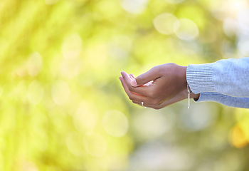 Image showing Nature, religion and muslim woman with praying hands in a park for islamic worship or praise. Spiritual, hope and islam female with open palms for prayer in a garden or backyard with trees bokeh.