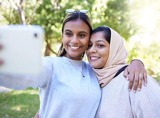 Image showing Girl, friends and islam for selfie in park with smile, hug and happy for summer, adventure or outdoor bonding. Women, muslim and profile picture for social media app, happiness and together in nature